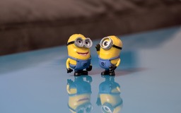 Smiling Minions on Blue Backgrounds: Free JPG Downloads for Graphics and Web Design