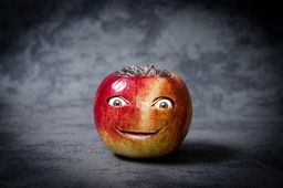 Get a Smile with Our Free Apple Funny Face Backgrounds - Download in JPG Format for Graphics, Banners, Advertising, and Design