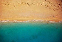 Get the Perfect Beachy Summer Vibes with Our Free Aerial View Shoreline Background in JPG Format