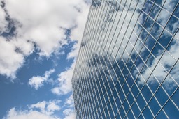 Architectural Beauty: Stunning Building Images with Reflection and Clouds for Free Download