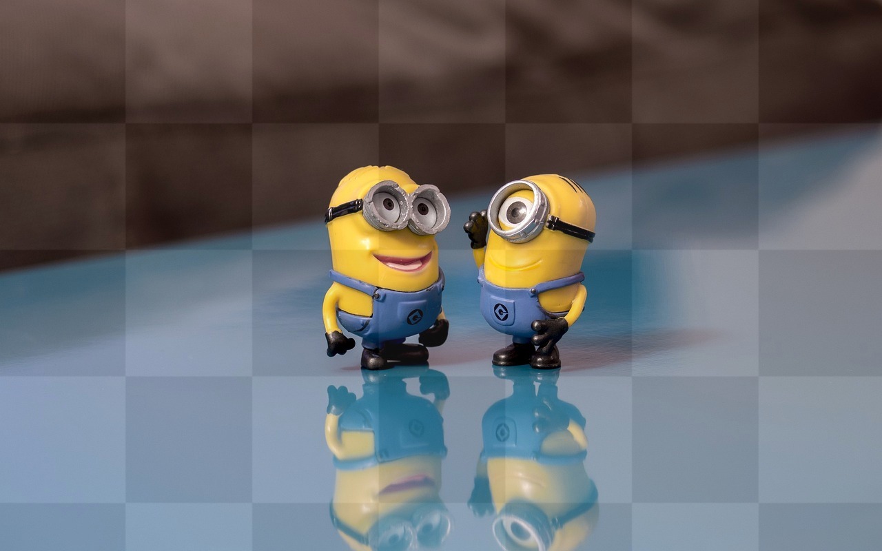 Smiling Minions on Blue Backgrounds: Free JPG Downloads for Graphics and Web Design